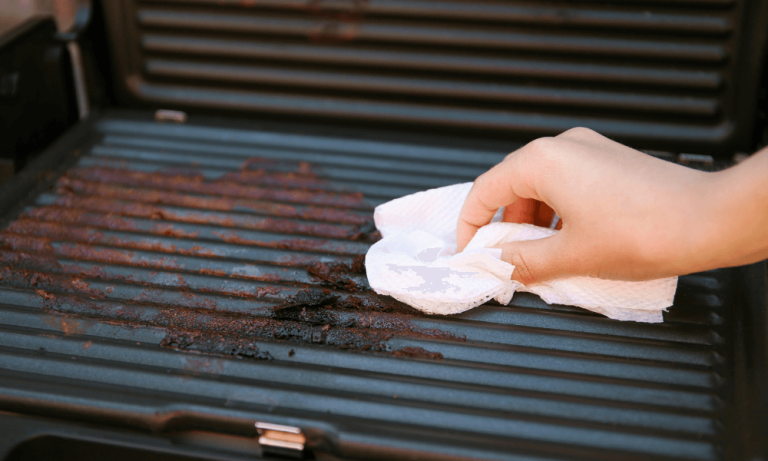
Cleaning the grate after grilling.					